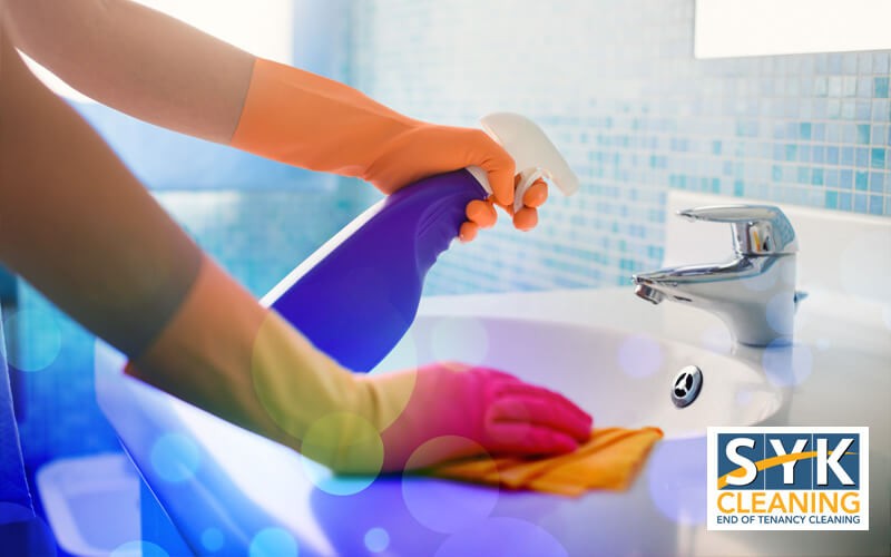 woman cleaning bathroom